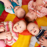 Overhead View Of Babies Having Fun At Nursery Playgroup